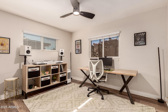 office with hardwood / wood-style flooring and ceiling fan