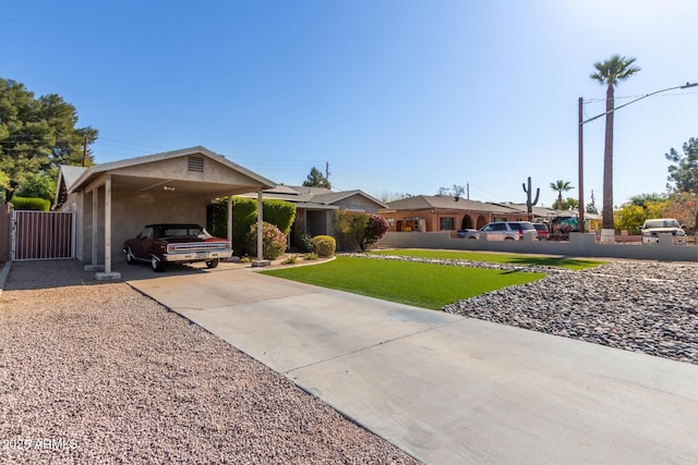 ranch-style house featuring a carport