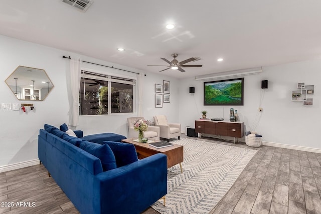 living room with hardwood / wood-style flooring and ceiling fan