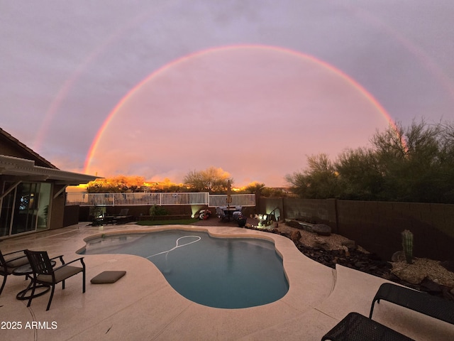 view of pool with a patio area, a fenced in pool, and a fenced backyard