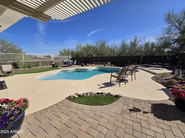 view of pool featuring a patio, a fenced in pool, a fenced backyard, and a pergola