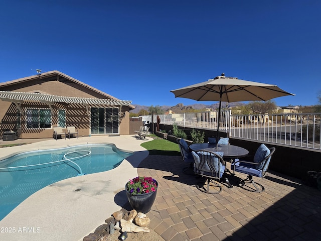 view of swimming pool with a patio area, a fenced in pool, a pergola, and fence