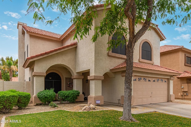 1231 W Mediterranean Dr, Gilbert, AZ 85233 - mediterranean / spanish-style home with a tile roof, stucco siding, and concrete driveway