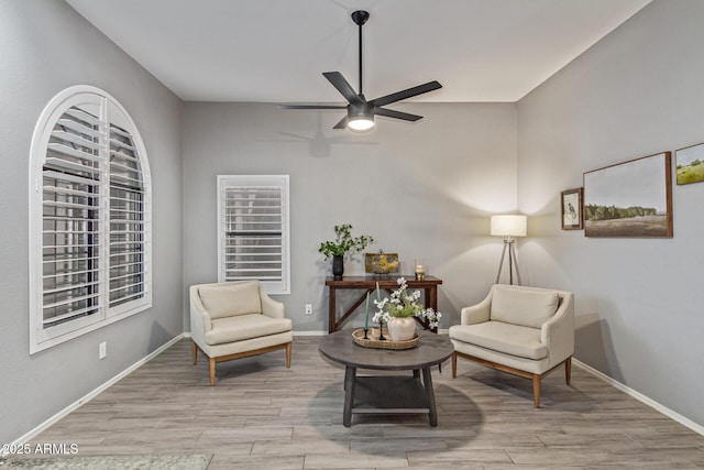 1231 W Mediterranean Dr, Gilbert, AZ 85233 - living area with ceiling fan, wood finished floors, and baseboards