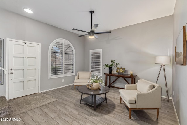 1231 W Mediterranean Dr, Gilbert, AZ 85233 - living area with baseboards, light wood finished floors, and ceiling fan