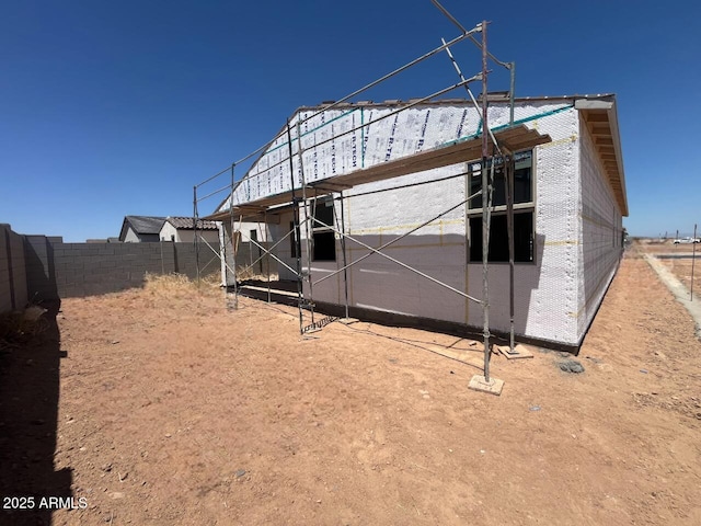 view of side of property with fence