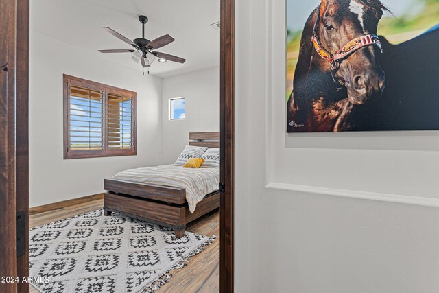 bedroom featuring ceiling fan and light wood-type flooring