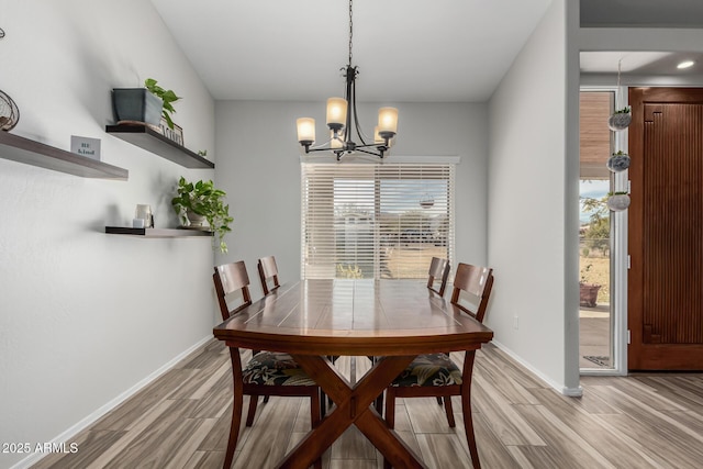 dining space featuring an inviting chandelier