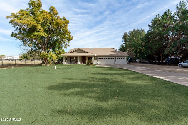 view of front facade featuring a garage and a front yard