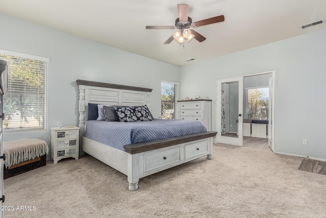 bedroom with light carpet and ceiling fan