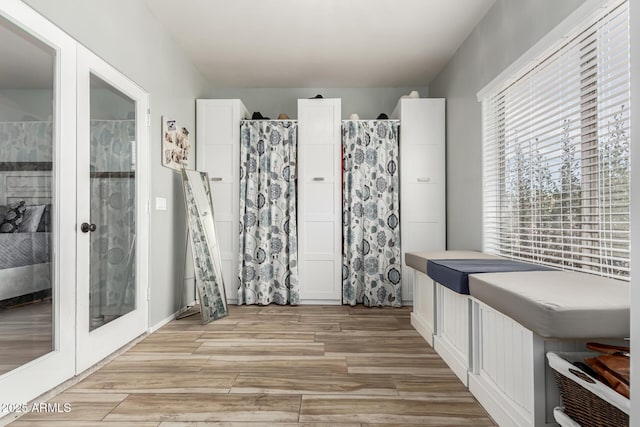 bathroom featuring french doors and hardwood / wood-style flooring