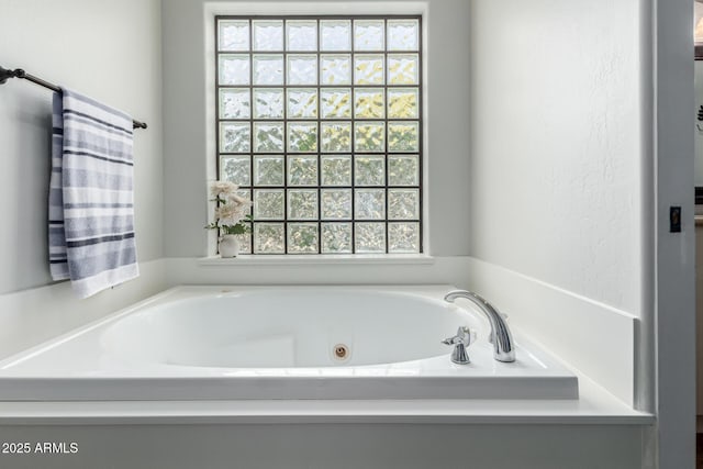 bathroom featuring a tub