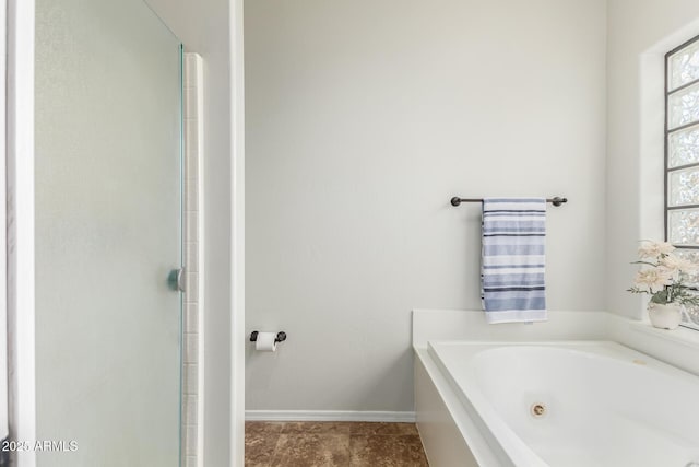 bathroom with a tub to relax in