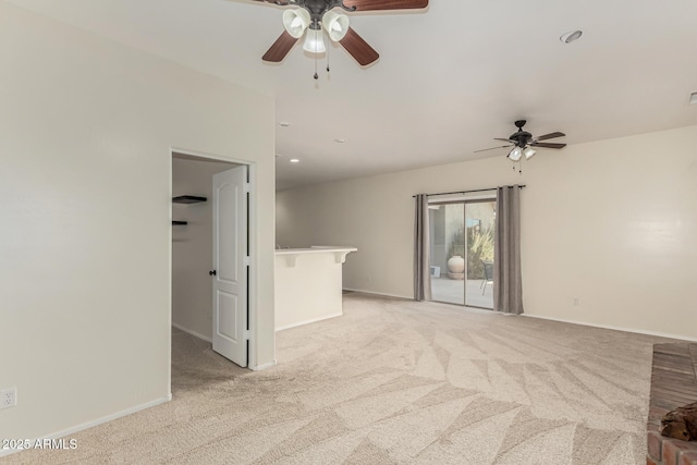 empty room with light colored carpet and ceiling fan