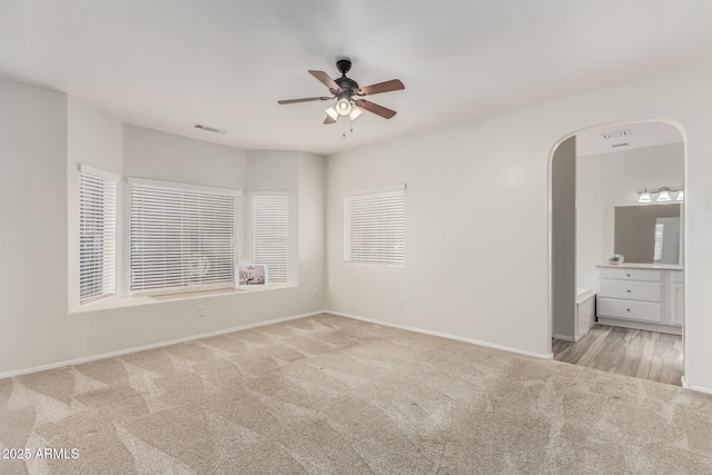 carpeted empty room with ceiling fan