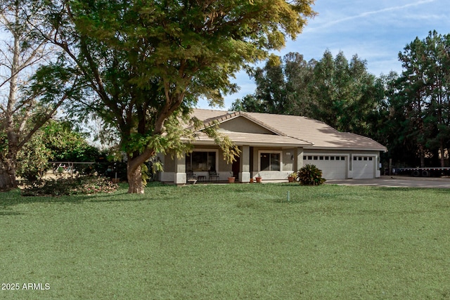 view of front facade featuring a garage and a front yard