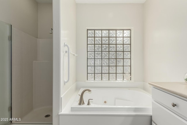 bathroom featuring vanity and plus walk in shower