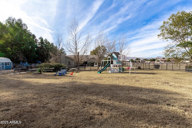 view of jungle gym with a lawn