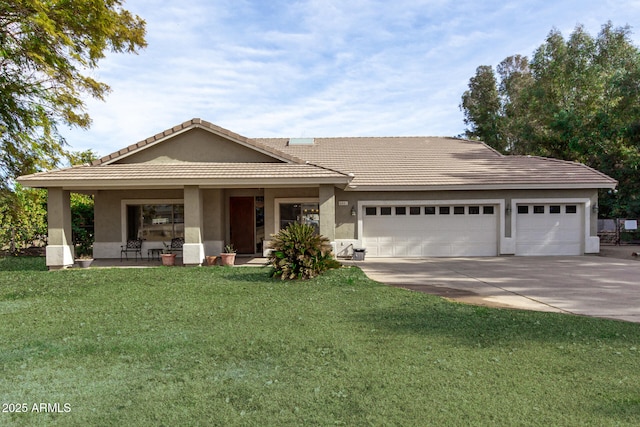 view of front of home with a garage and a front yard