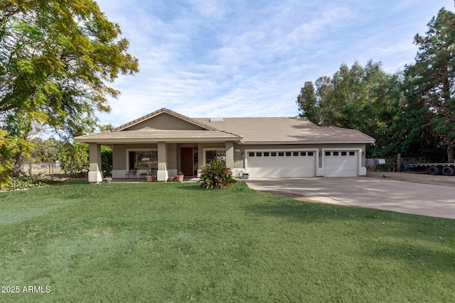 view of front facade with a garage, covered porch, and a front lawn