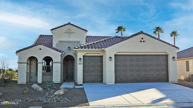 mediterranean / spanish-style house featuring a garage, a porch, and cooling unit