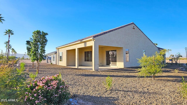 rear view of house with a patio