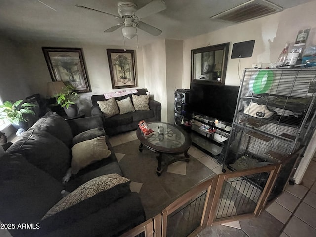 tiled living room with ceiling fan and visible vents