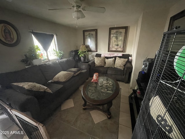 living room with a ceiling fan and tile patterned floors