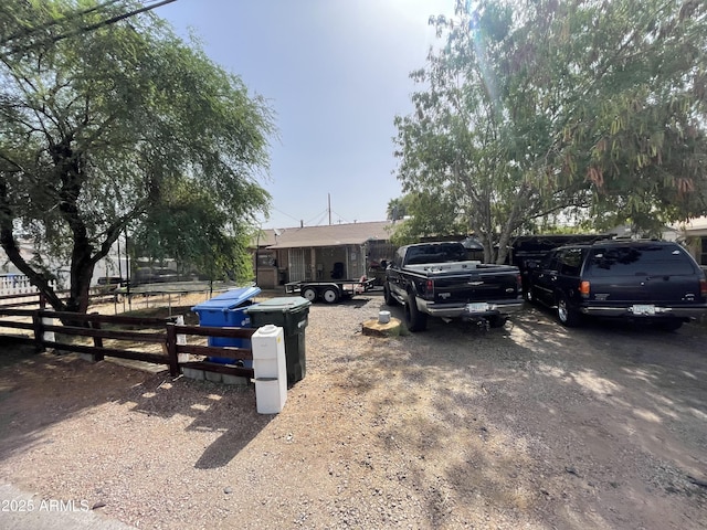 single story home featuring fence