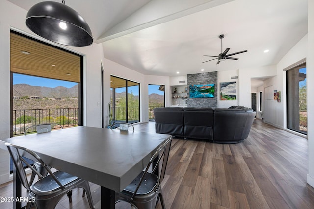 15261 E Golden Eagle Blvd, Fountain Hills, AZ 85268 - dining room with wood finished floors, lofted ceiling, a mountain view, ceiling fan, and recessed lighting