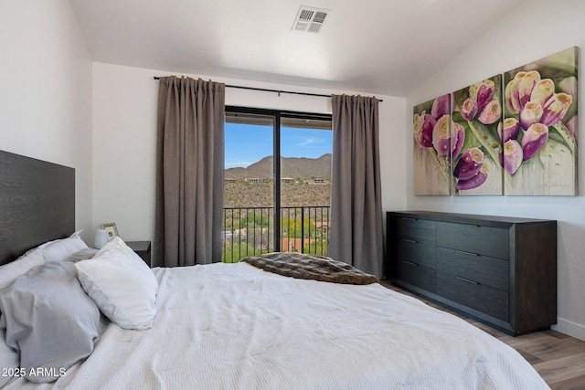 15261 E Golden Eagle Blvd, Fountain Hills, AZ 85268 - bedroom featuring lofted ceiling, access to outside, wood finished floors, and a mountain view