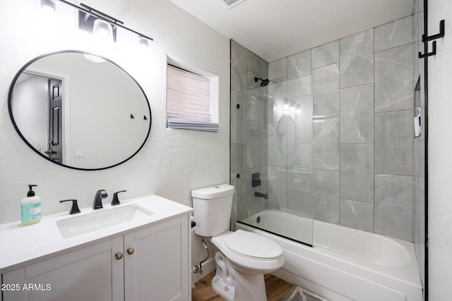 15261 E Golden Eagle Blvd, Fountain Hills, AZ 85268 - bathroom with vanity,  shower combination, wood finished floors, and a textured wall