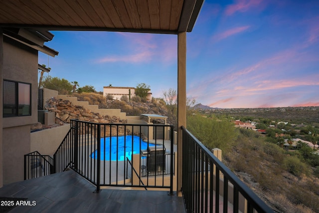 15261 E Golden Eagle Blvd, Fountain Hills, AZ 85268 - balcony at dusk with view of pool area