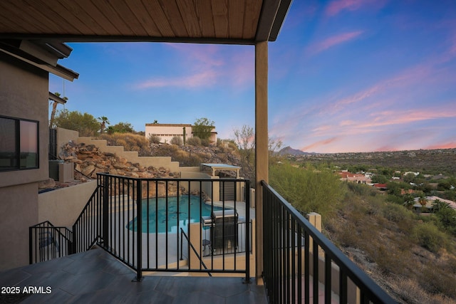 15261 E Golden Eagle Blvd, Fountain Hills, AZ 85268 - balcony at dusk featuring view of pool area