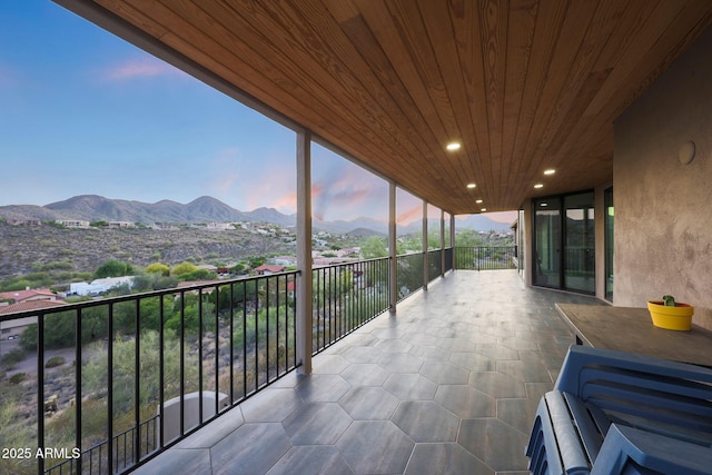 15261 E Golden Eagle Blvd, Fountain Hills, AZ 85268 - patio terrace at dusk featuring a mountain view and a balcony