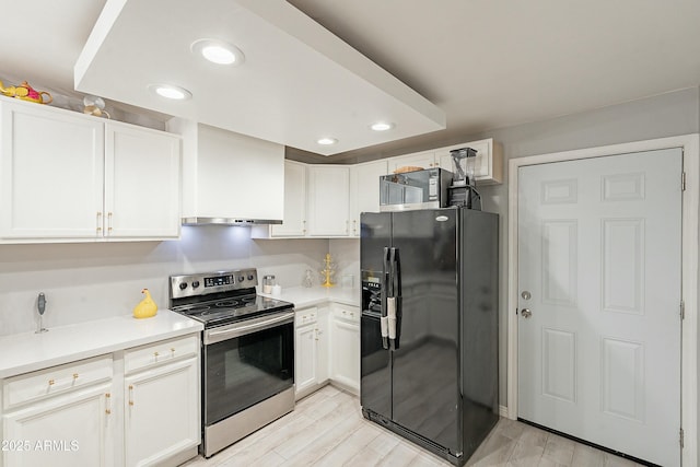 kitchen with white cabinetry, wood tiled floor, appliances with stainless steel finishes, and light countertops