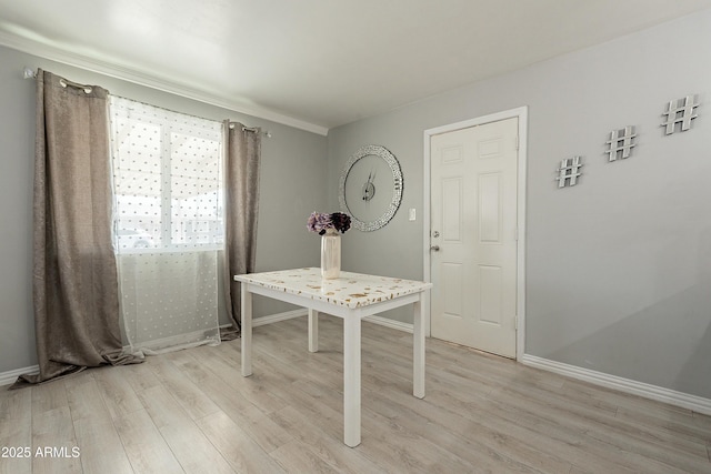 interior space featuring light wood-style floors and baseboards