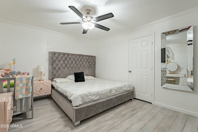 bedroom featuring light wood-style flooring and crown molding