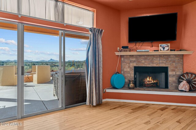 unfurnished living room with wood-type flooring