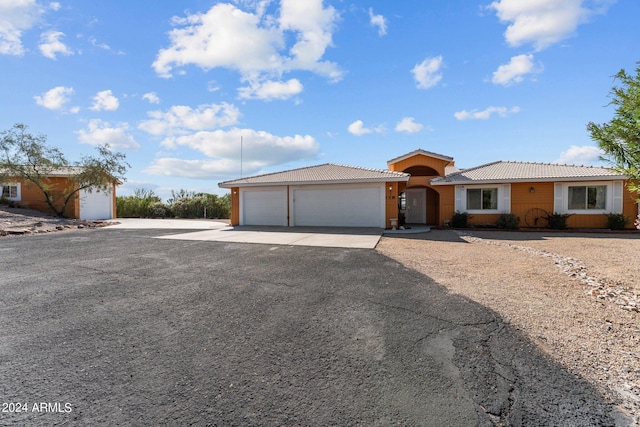 single story home with a garage