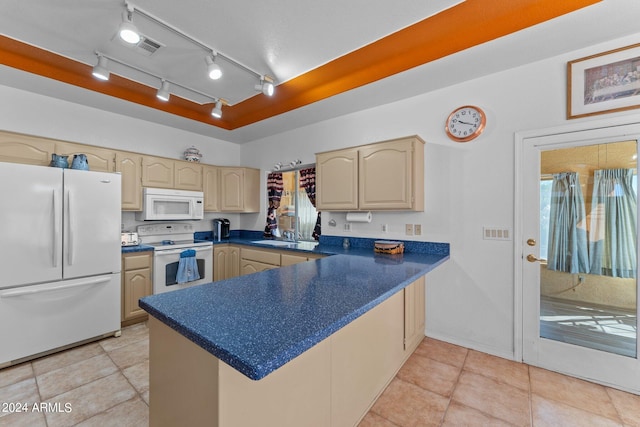 kitchen with track lighting, light brown cabinetry, white appliances, and light tile patterned flooring