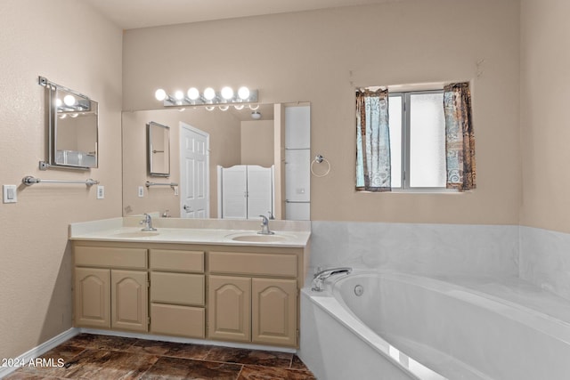 bathroom featuring vanity and a bathing tub