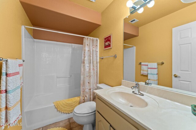 full bathroom featuring shower / tub combo with curtain, tile patterned flooring, vanity, and toilet