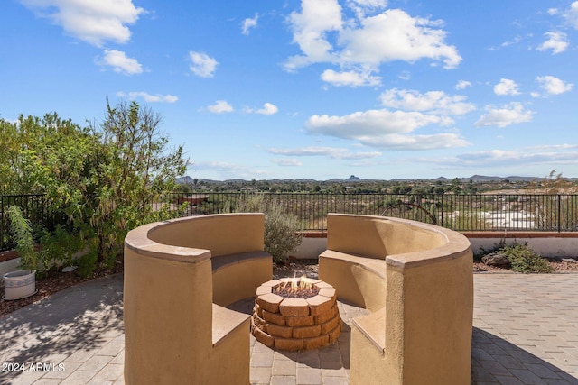 1216 Easy St, Wickenburg, AZ 85390 - view of patio / terrace with an outdoor fire pit and a mountain view