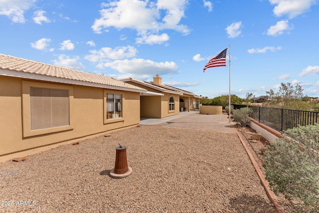 1216 Easy St, Wickenburg, AZ 85390 - back of property featuring a patio area, stucco siding, roof mounted solar panels, and a tiled roof