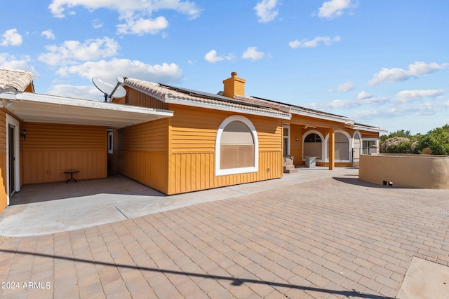 view of front of house with a carport