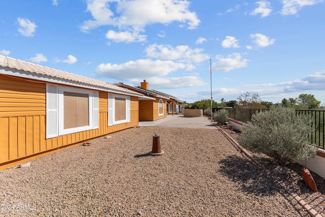 view of side of home featuring a patio