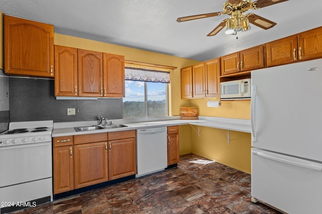 kitchen featuring white appliances, sink, and ceiling fan