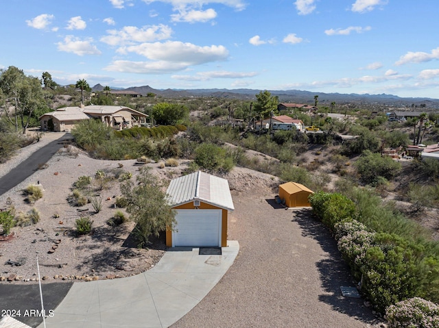 birds eye view of property with a mountain view