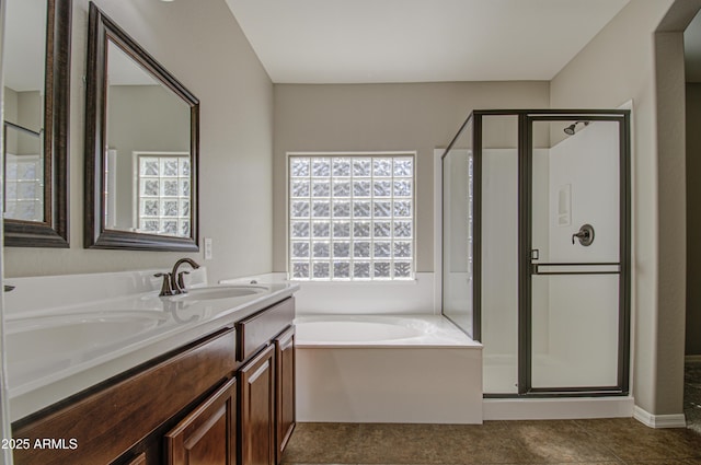 bathroom with a shower stall, vanity, and a bath